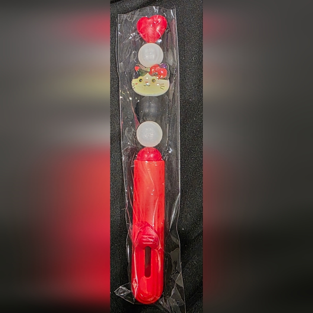 Red and Black Character-Themed Pen